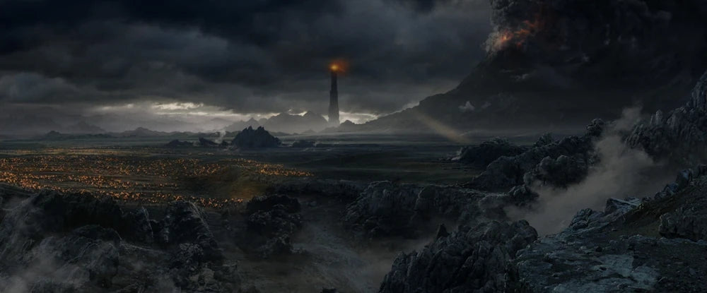 A dramatic fantasy landscape artwork showing a dark volcanic or mountainous terrain under heavy storm clouds, with a tall glowing tower or spire in the distance and a bright orange fire or light at the top.
