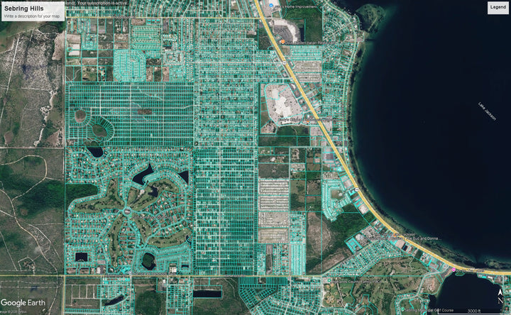 Aerial satellite view of Sebring Hills showing a grid of residential neighborhoods, roads, ponds, and a large dark body of water along the right side.